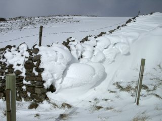 Snow blown through wall