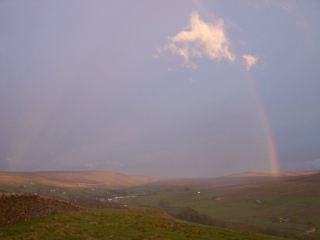 Rainbow with anti-crepuscular rays